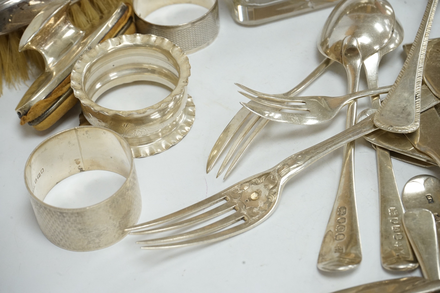 A set of six Elizabeth II silver feather edge Old English pattern soup spoons by James Dixon & Sons, Sheffield, 1968, 16.6cm, together with fourteen items of assorted 19th century and later silver flatware, three silver